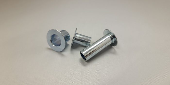fasteners-that-provide-different-types-of-special-steel-compression-limiter-tubes-insert | fasteners-distributor-near-in-st-charles | special-steel-compression-limiter-tubes-insert-scaled a-couple-of-screws-sitting-on-top-of-a-table.